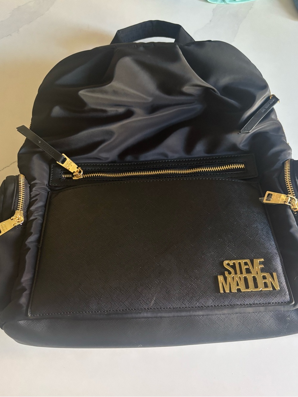 Steve Madden Black and Gold Backpack with Sophisticated Design